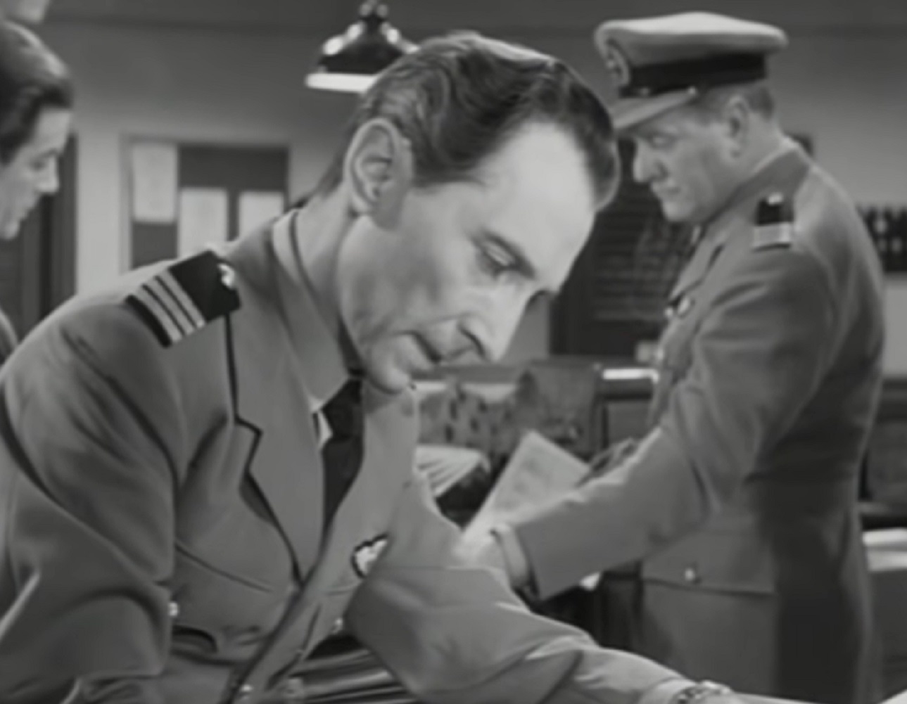 Screenshot of Peter Cushing reading - from Cone of Silence (1960)