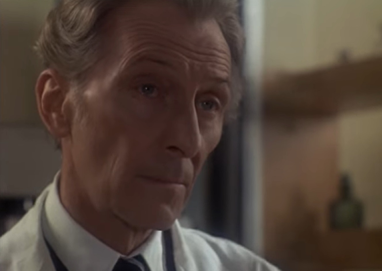 Screenshot of Peter Cushing looking at side - from Nothing But the Night (1973)