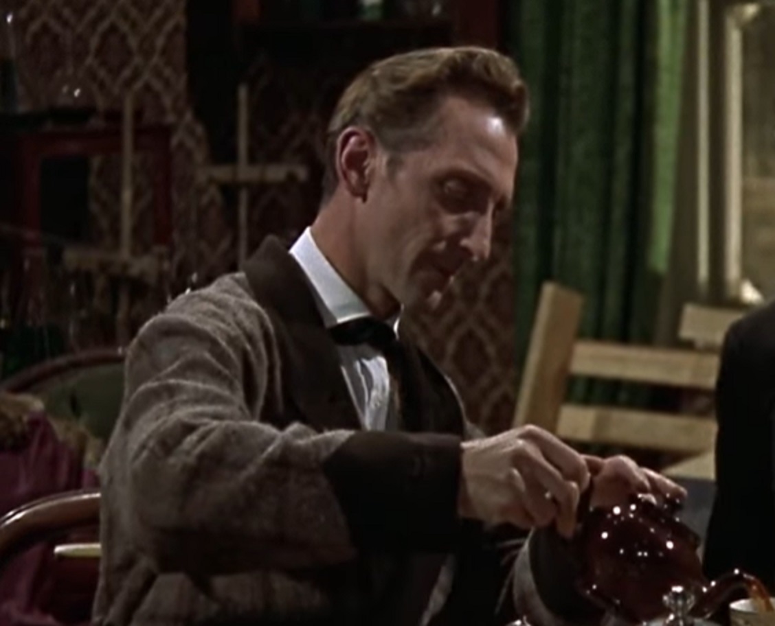 Screenshot of Peter Cushing having a coffee - from The Hound of the Baskervilles (1959)