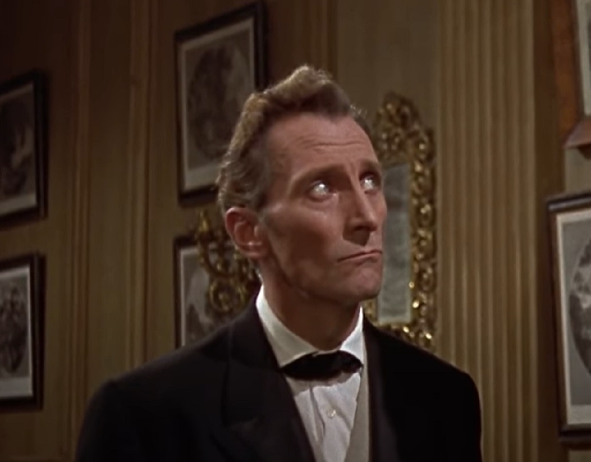 Screenshot of Peter Cushing wearing suit is looking up - from The Hound of the Baskervilles (1959)