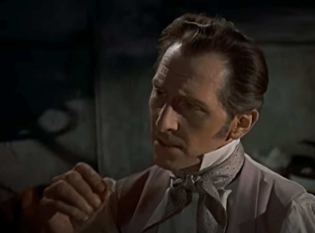 Screenshot of Peter Cushing looking at side - from The Revenge Of Frankenstein (1958)