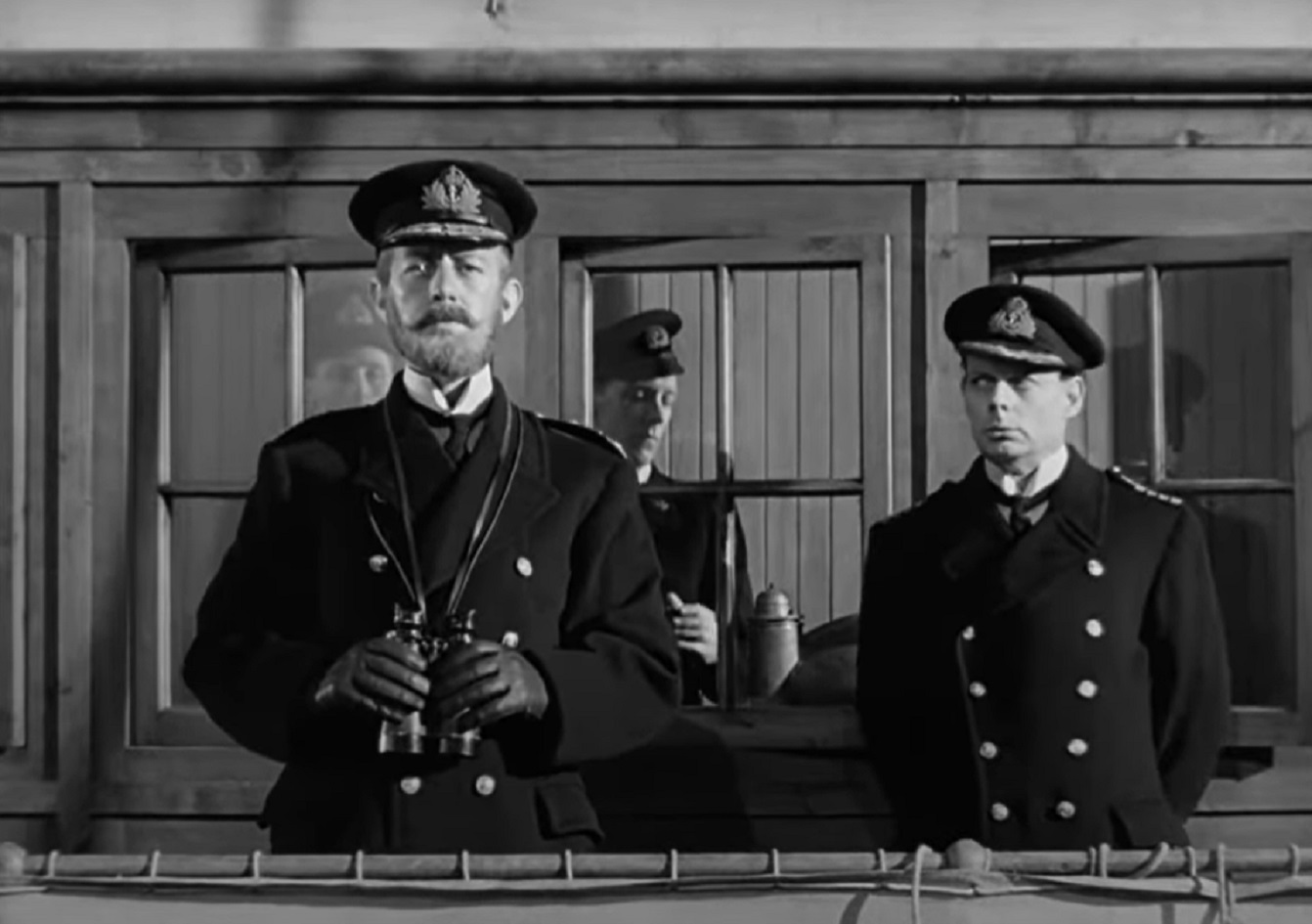 Screenshot of Alec Guinness standing in the deck of a ship - from Kind Hearts And Coronets (1949)