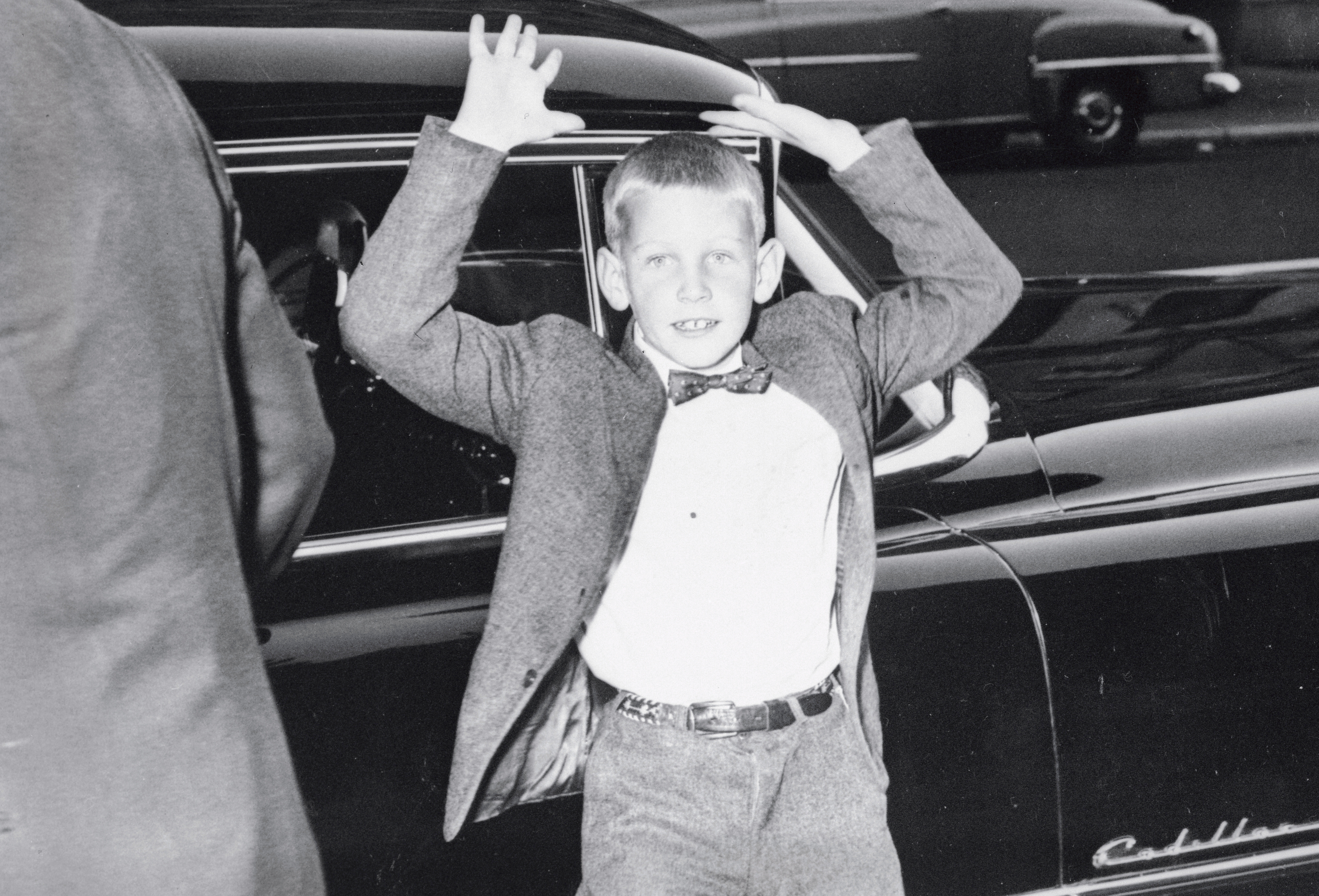 James Woodward Standing in Front of House