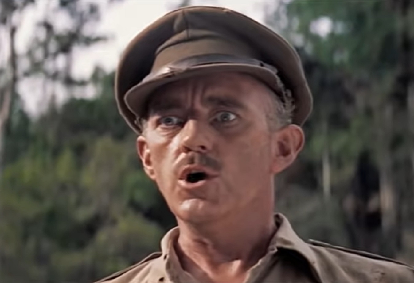 Screenshot of Alec Guinness in uniform is looking surprised - from The Bridge on the River Kwai (1957)