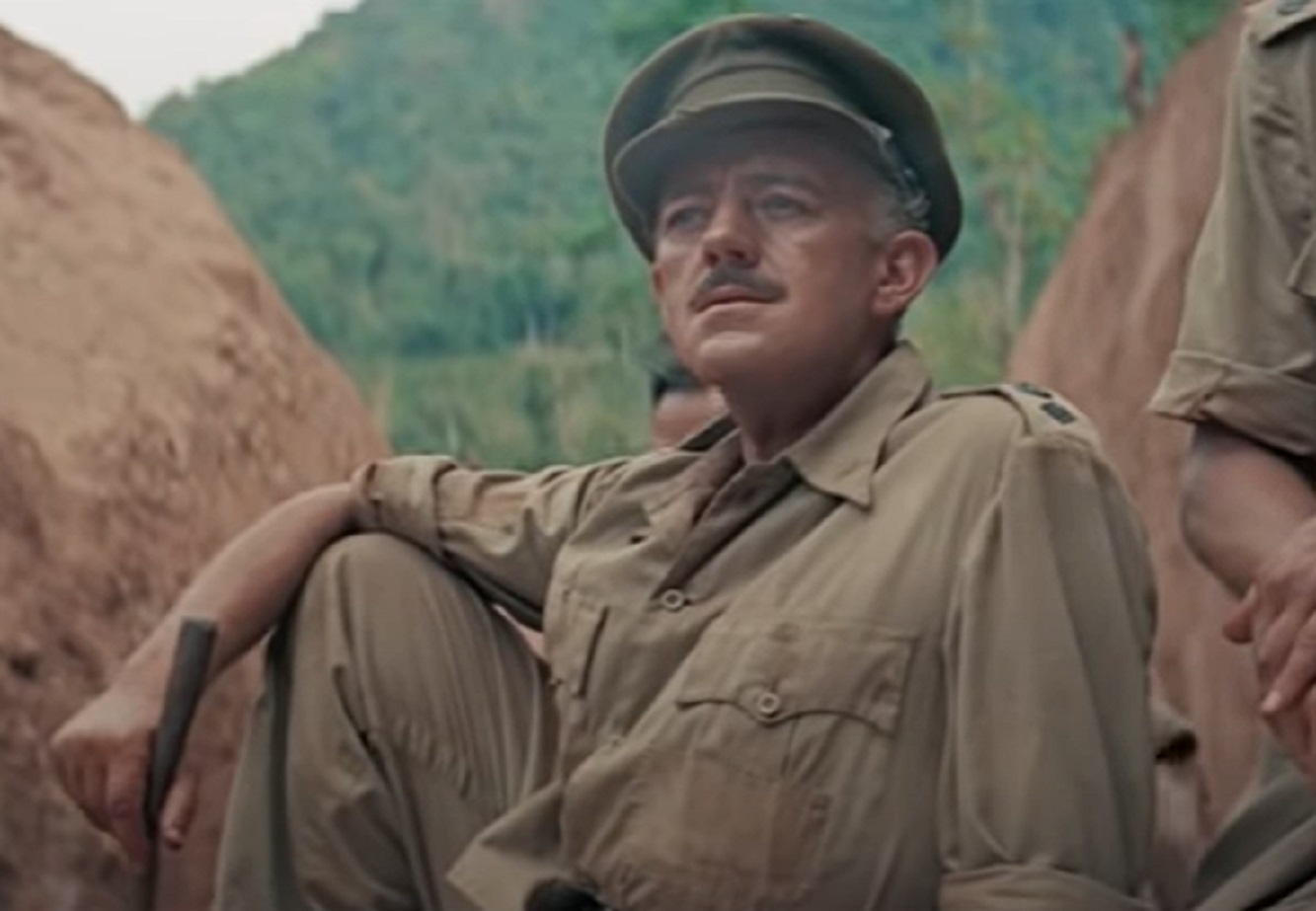 Screenshot of Alec Guinness in uniform is looking outside - from The Bridge on the River Kwai (1957)