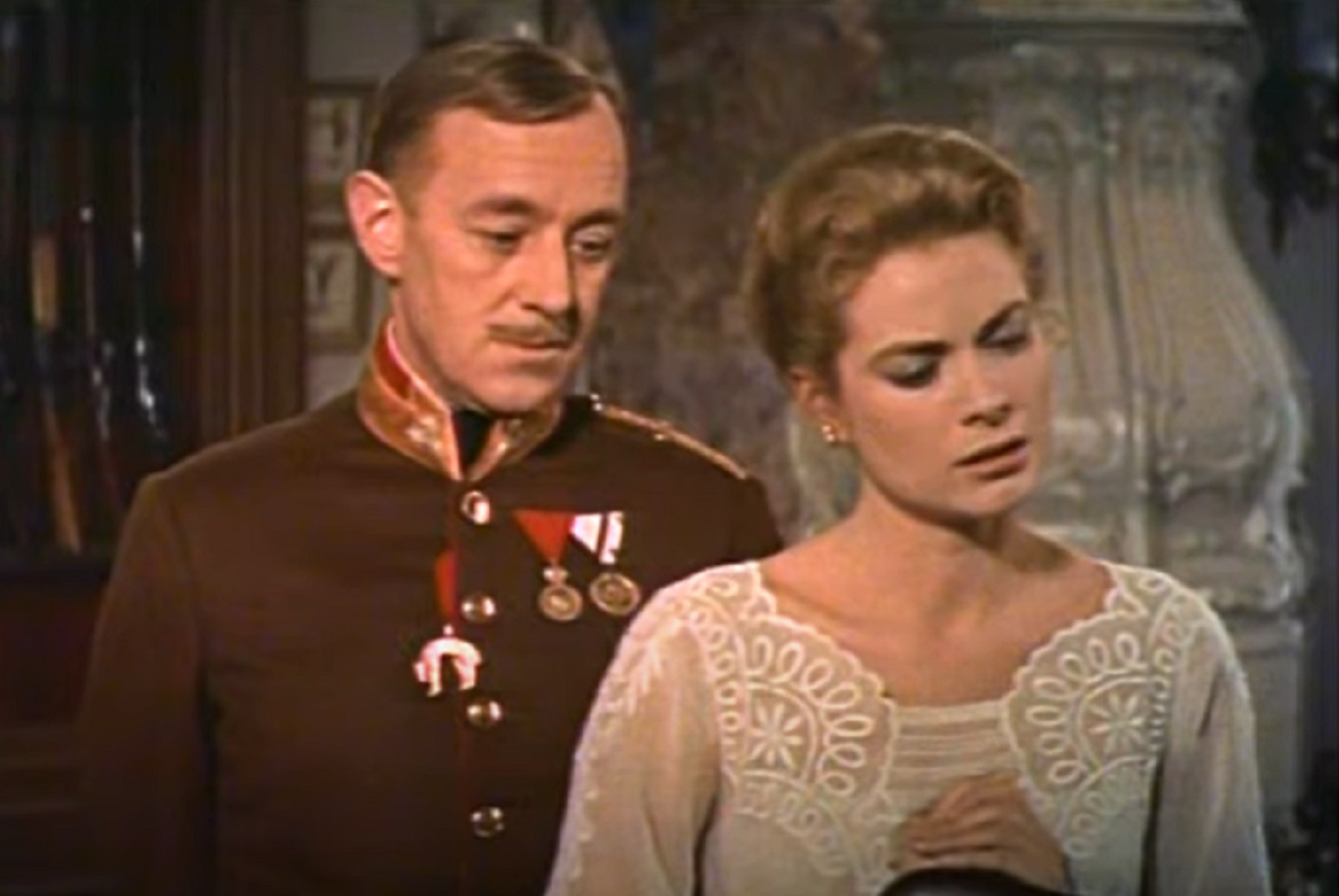 Screenshot of Alec Guinness and Grace Kelly talking - from The Swan (1956)