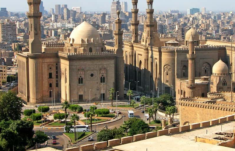 Big mosque in Cairo Egypt surrounded wit other buildings