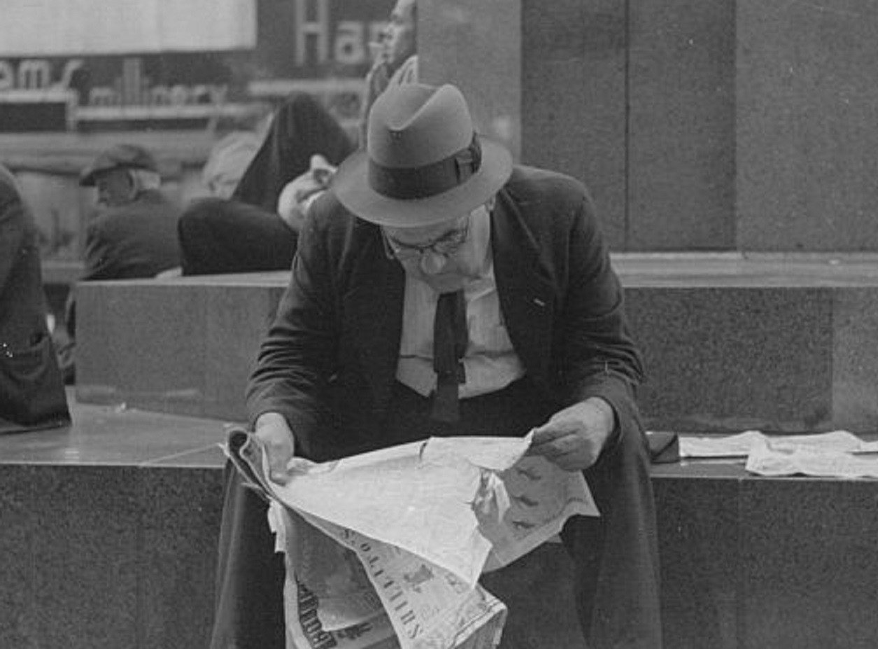 Man reading newspaper - 1938