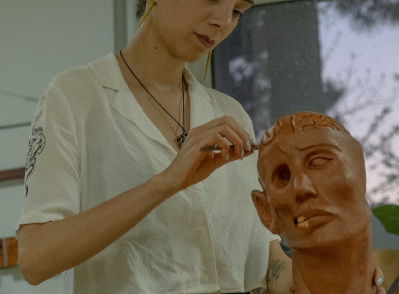 Woman working with model of brain