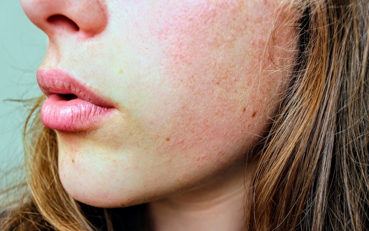 close up photo view of woman's face skin and hair