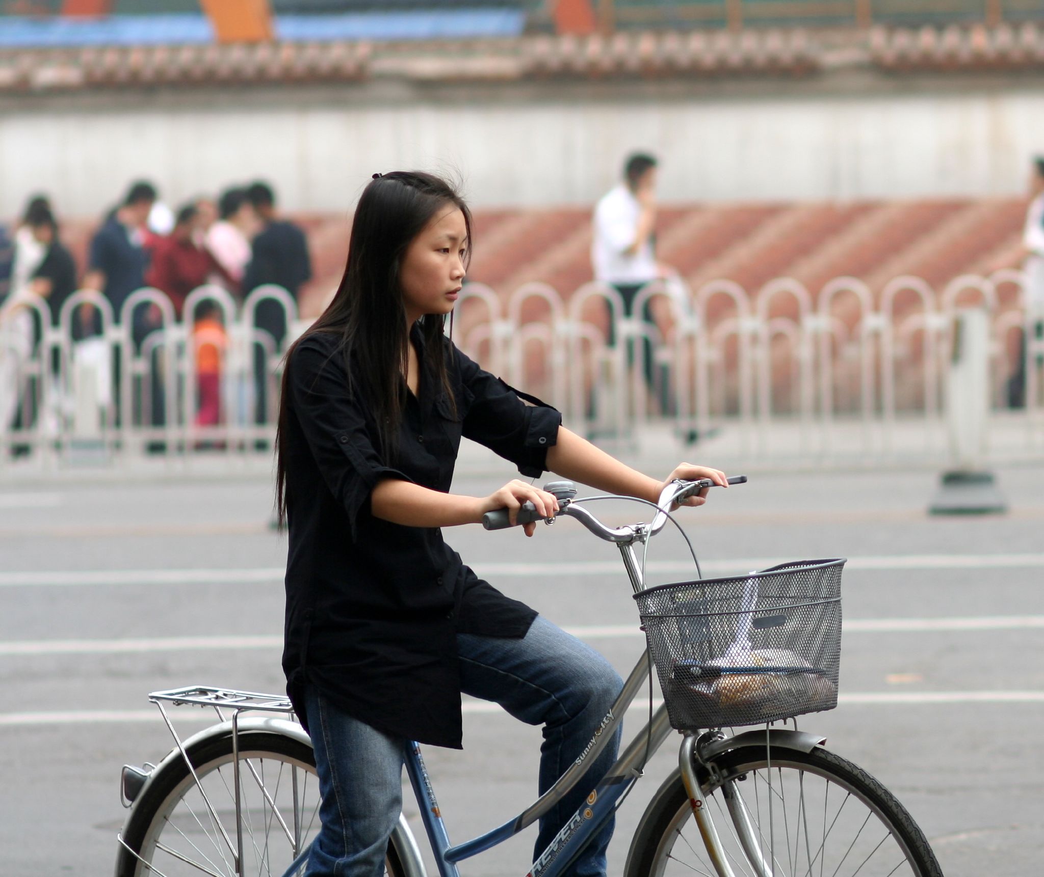 Woman on bike in Beijing
