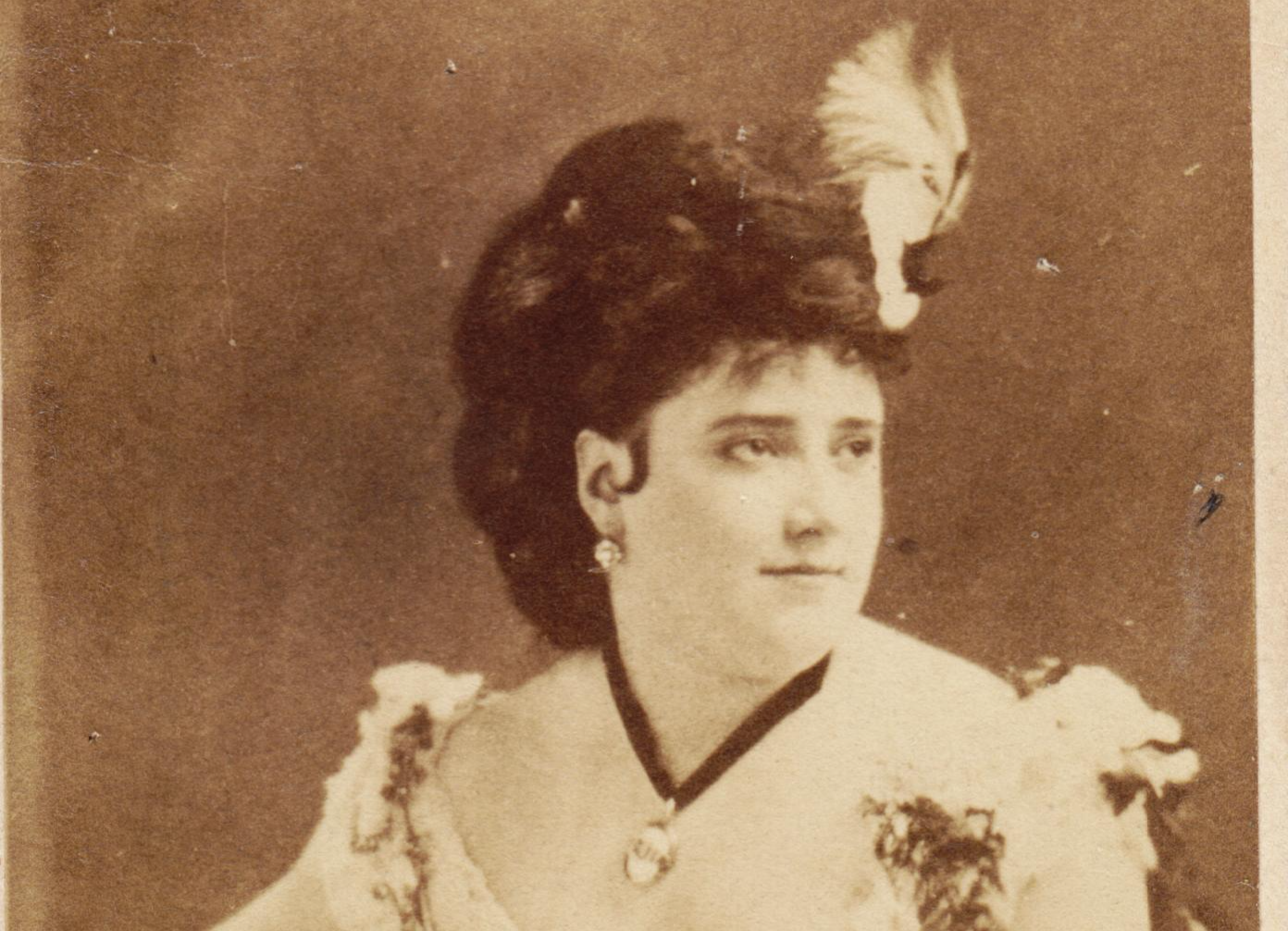 Grayscale portrait photo of Josie Mansfield wearing a white dress