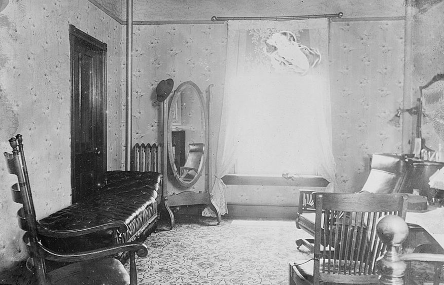 Grayscale Photo of vintage small room interior