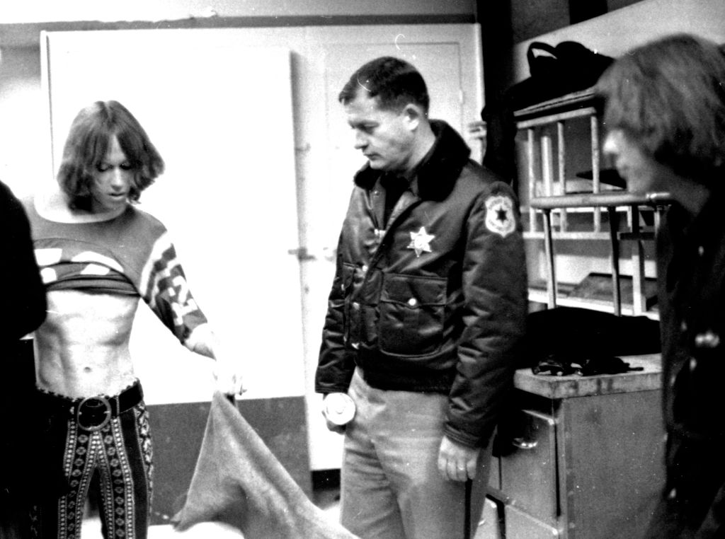Iggy Pop of the Stooges seen backstage at Delta College with a County Sheriff