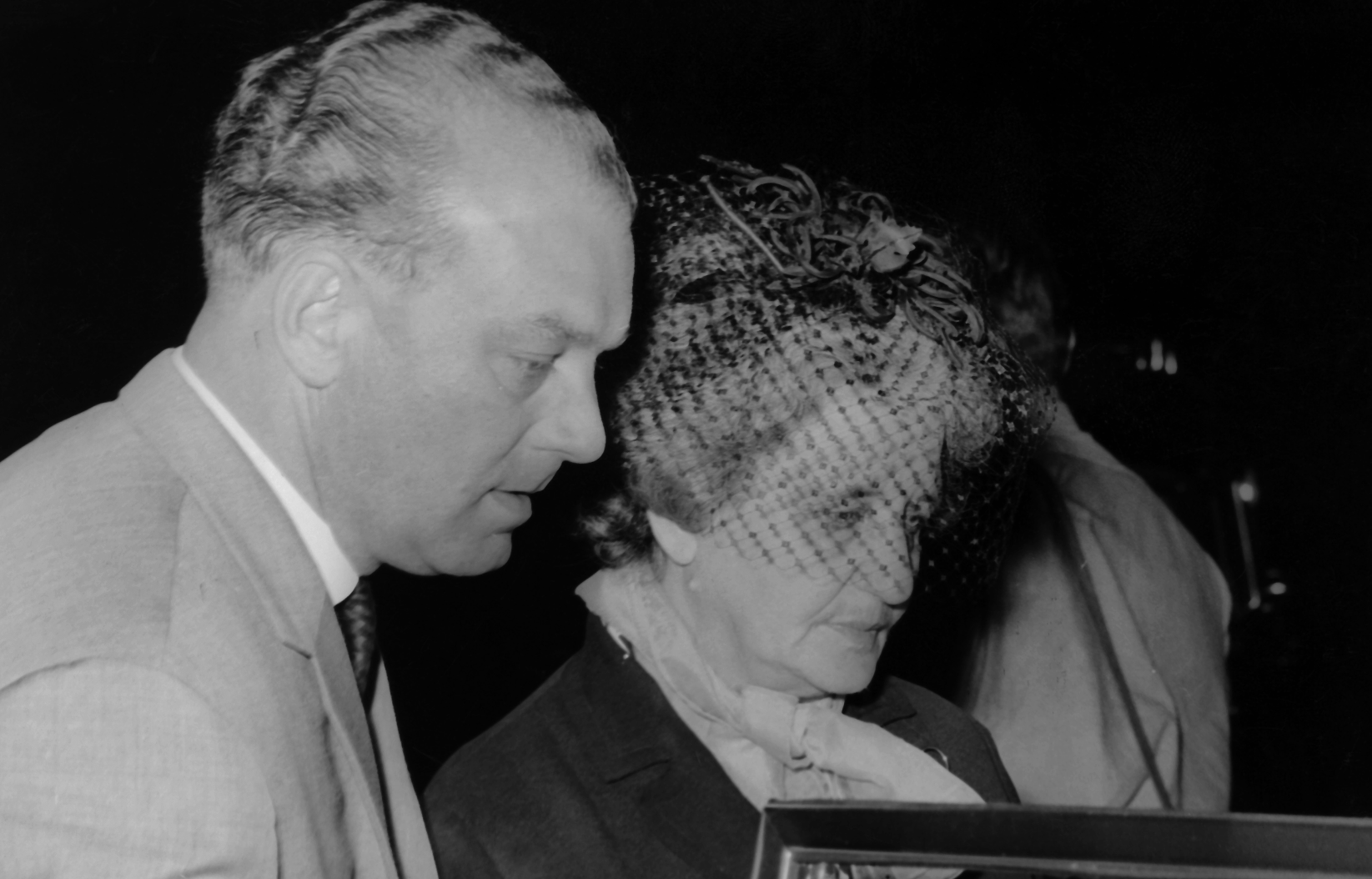 Laura Dominica Garello Ferrari in front of  a car