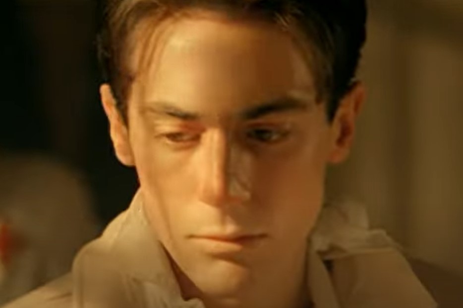 Elio Germano as Enzo Ferrari - 18 Years Old , sad