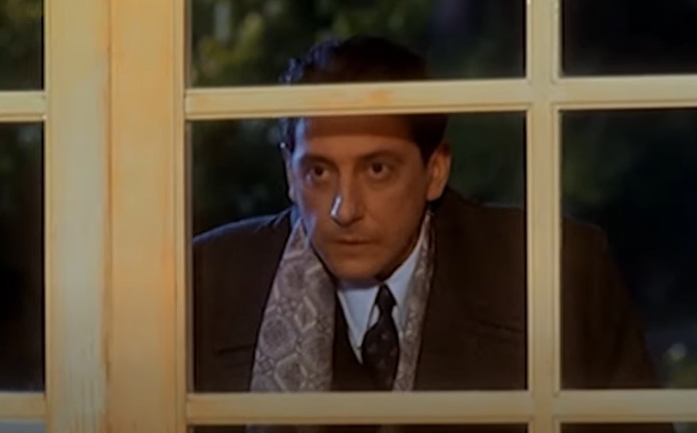 Sergio Castellitto as Enzo Ferrari in suit 