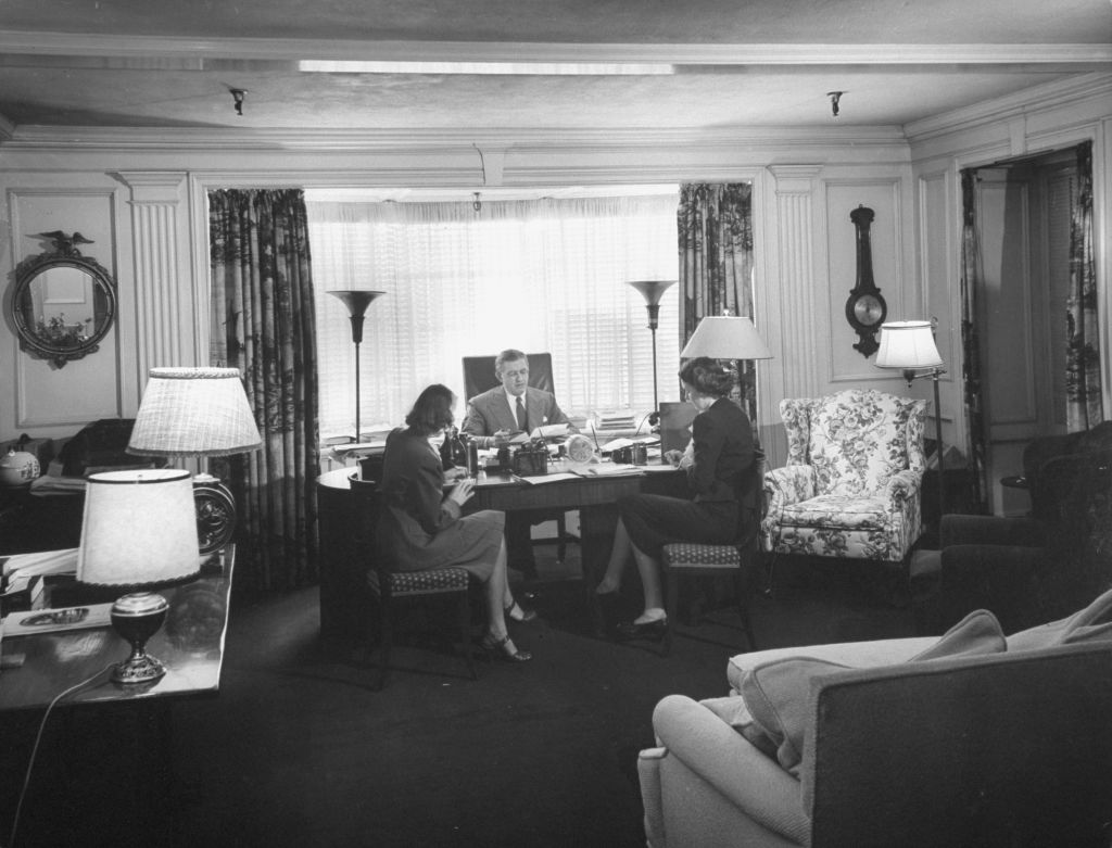 David O. Selznick (C) dictating to secretaries