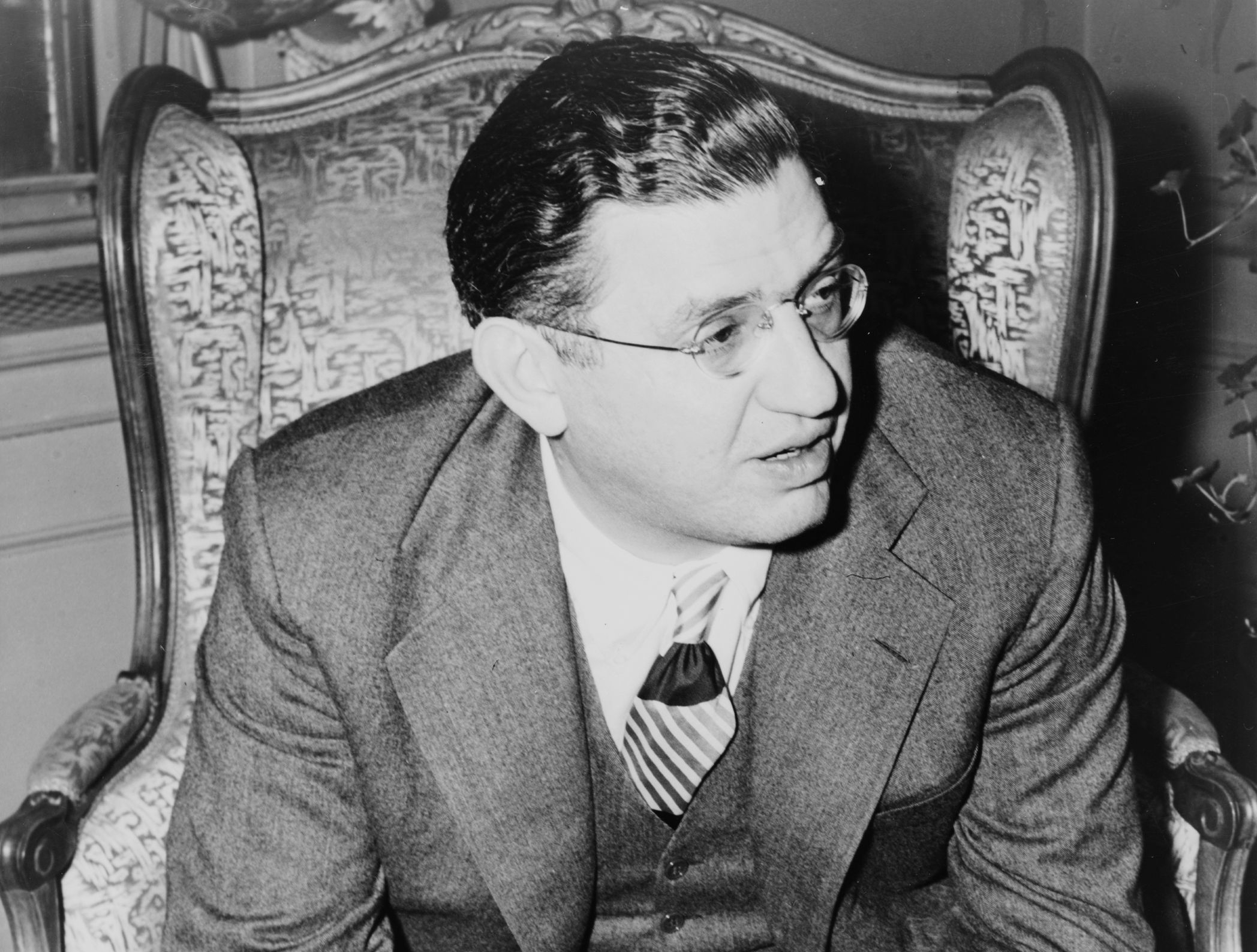 David O Selznick in suit sitting on armchair