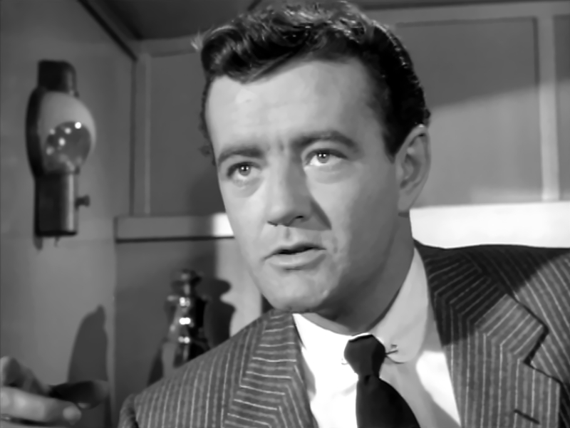 Robert Walker wearing gray suit