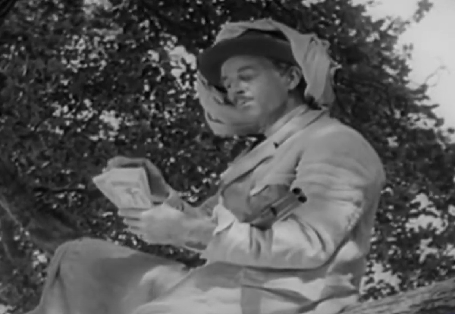 Screenshot of Black Bart (Arthur Space) looking at money - from Stories of the Century (1954-55)