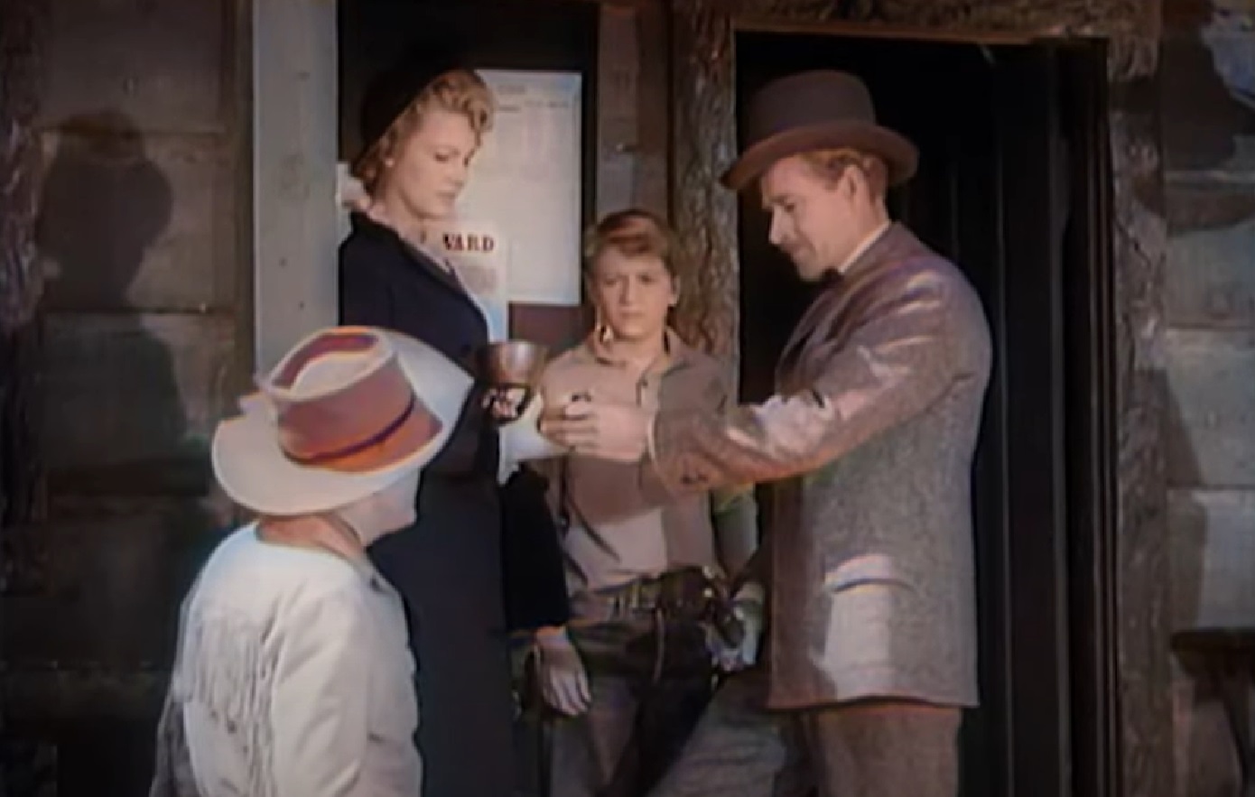 Screenshot of Black Bart (Arthur Space) with his wife standing outside - from Stories of the Century (1954-55)