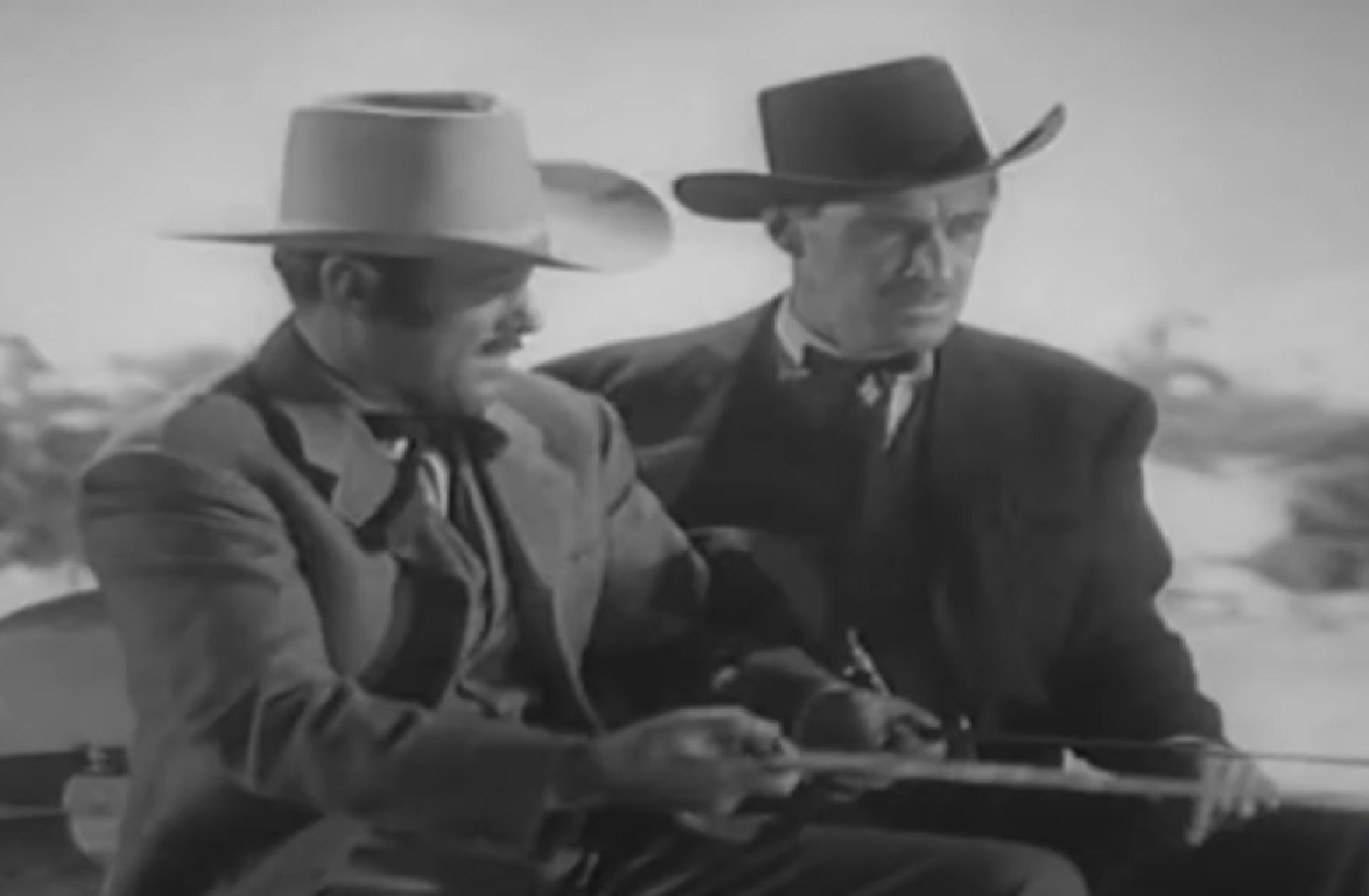 Screenshot of Black Bart (Arthur Space) in black suit is robbing stagecoach - from Stories of the Century (1954-55)