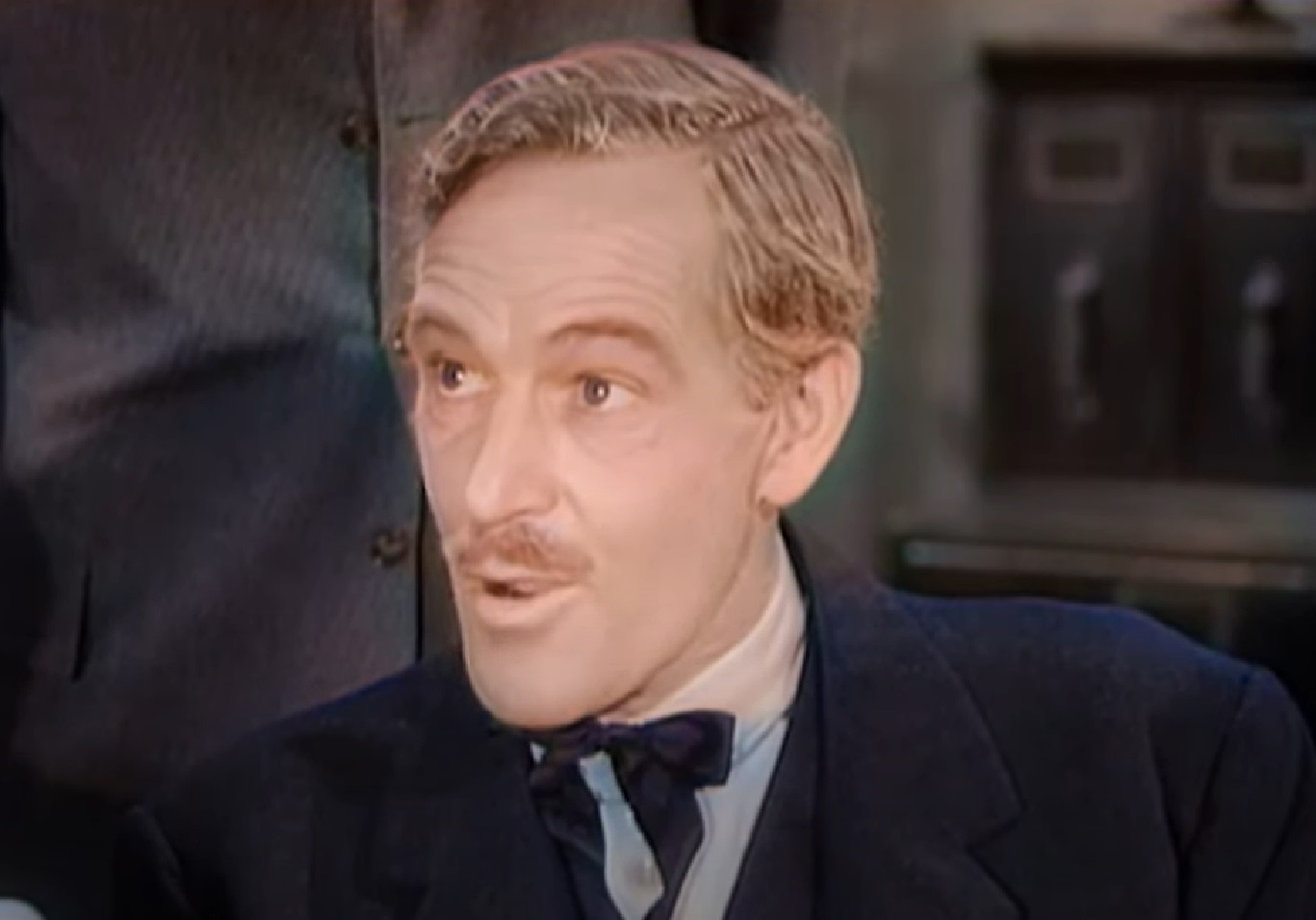 Screenshot of Black Bart (Arthur Space) in black suit is looking at side - from Stories of the Century (1954-55)