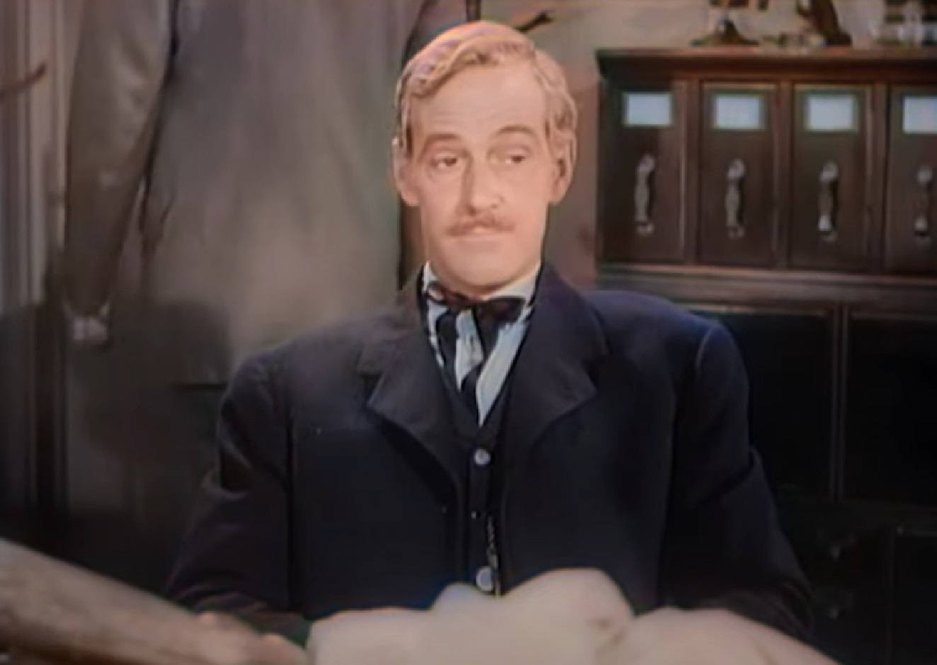 Screenshot of Black Bart (Arthur Space) seating in office - from Stories of the Century (1954-55)