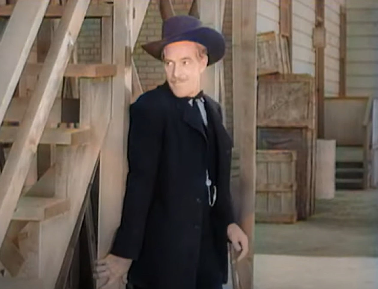 Screenshot of Black Bart (Arthur Space) standing outside in black suit - from Stories of the Century (1954-55)