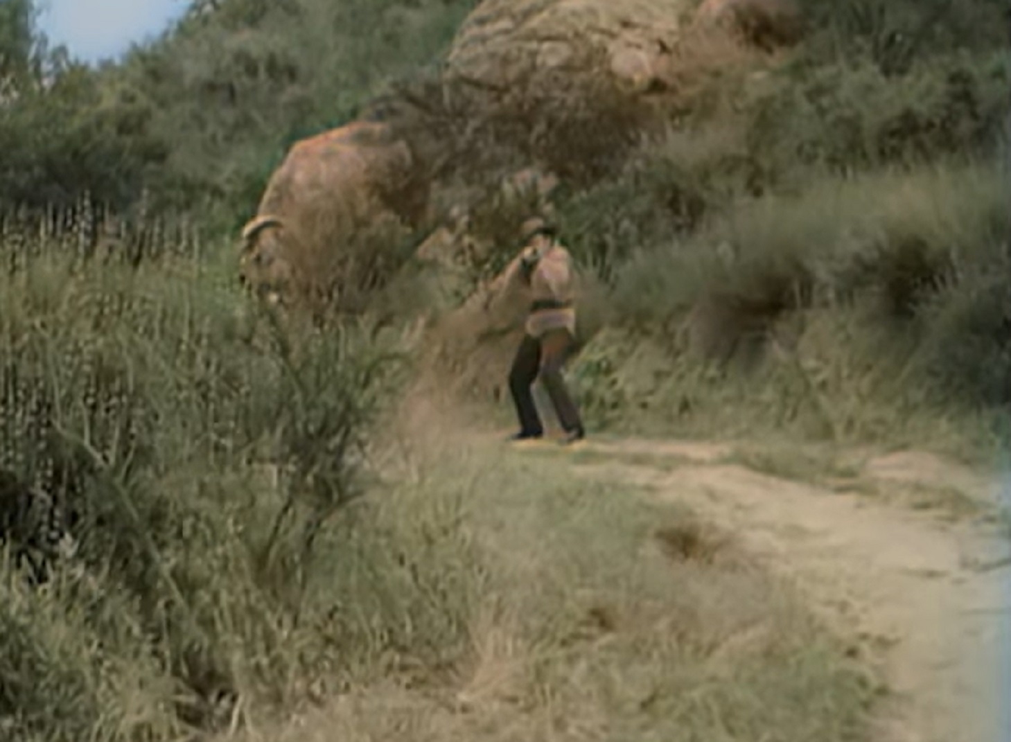 Screenshot of man with guns outside - from Stories of the Century (1954-55)