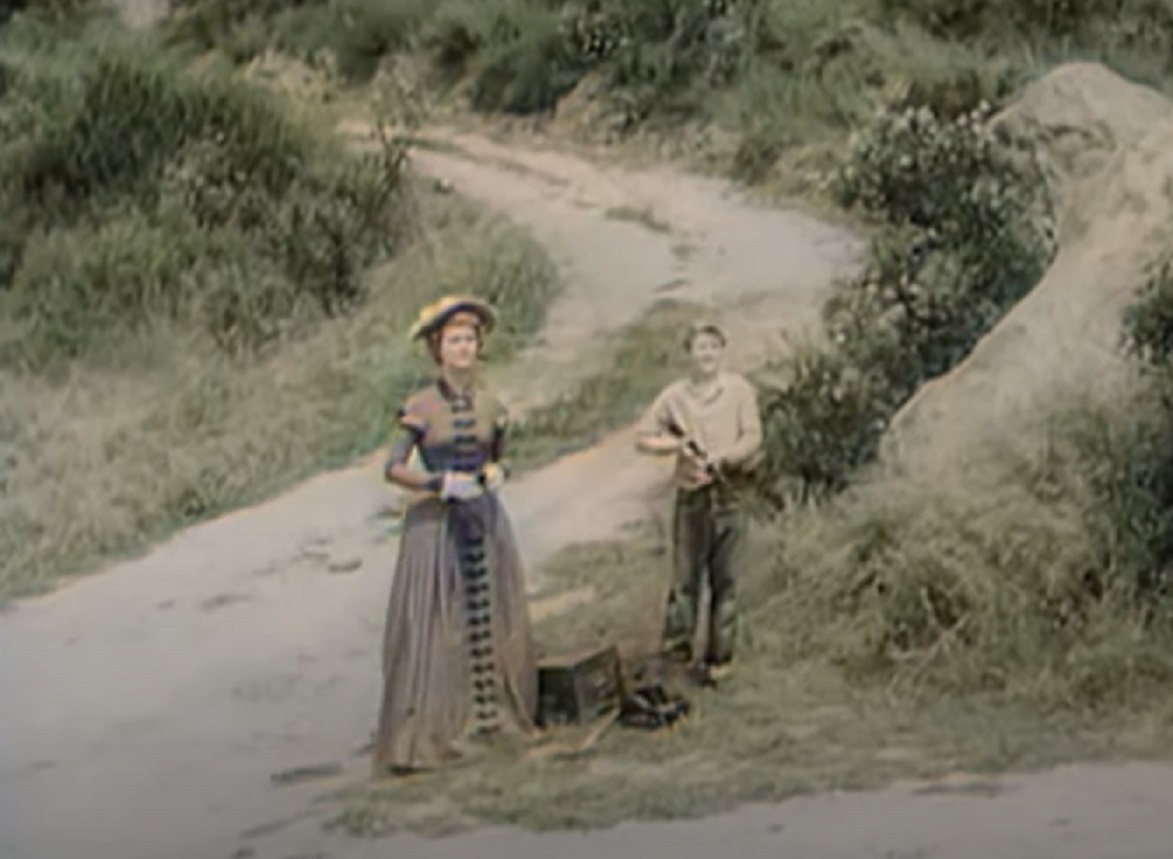 Screenshot of woman and kid with weapon - from Stories of the Century (1954-55)