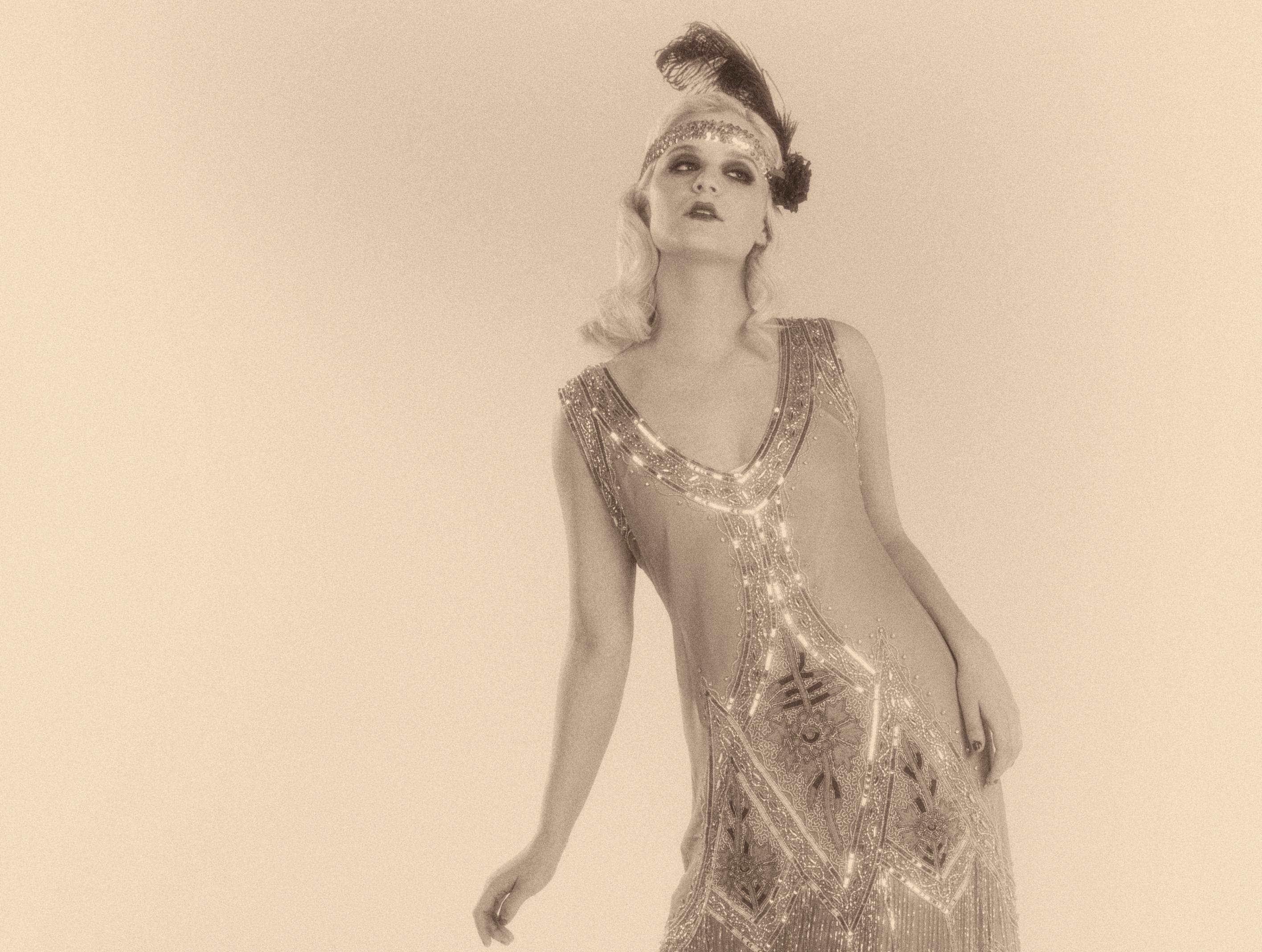 Woman dancing in a 1920's beaded flapper dress