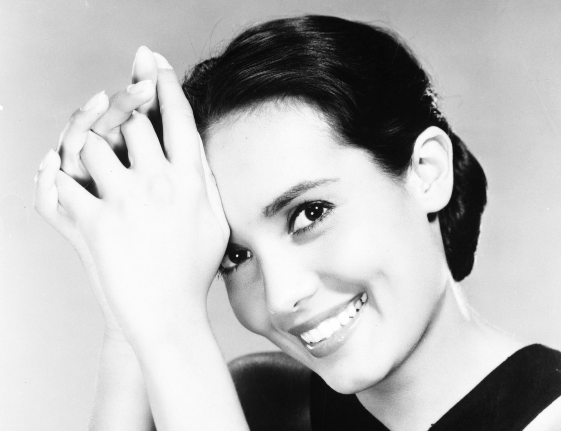 Anna Kashfi posing in black