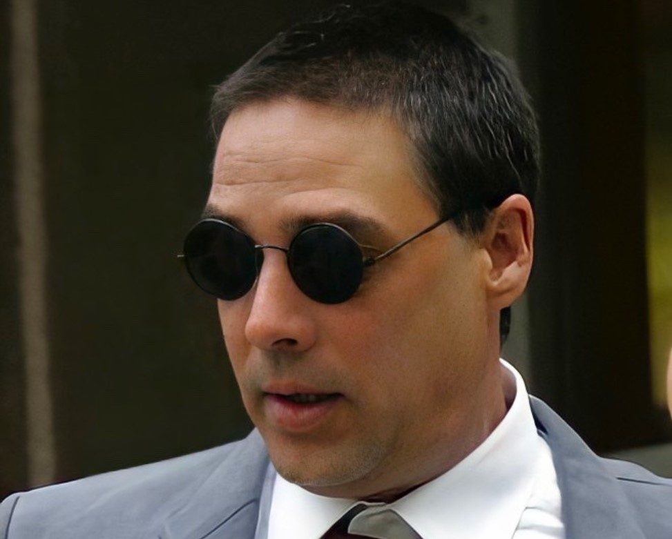 Christian Brando in gray suit