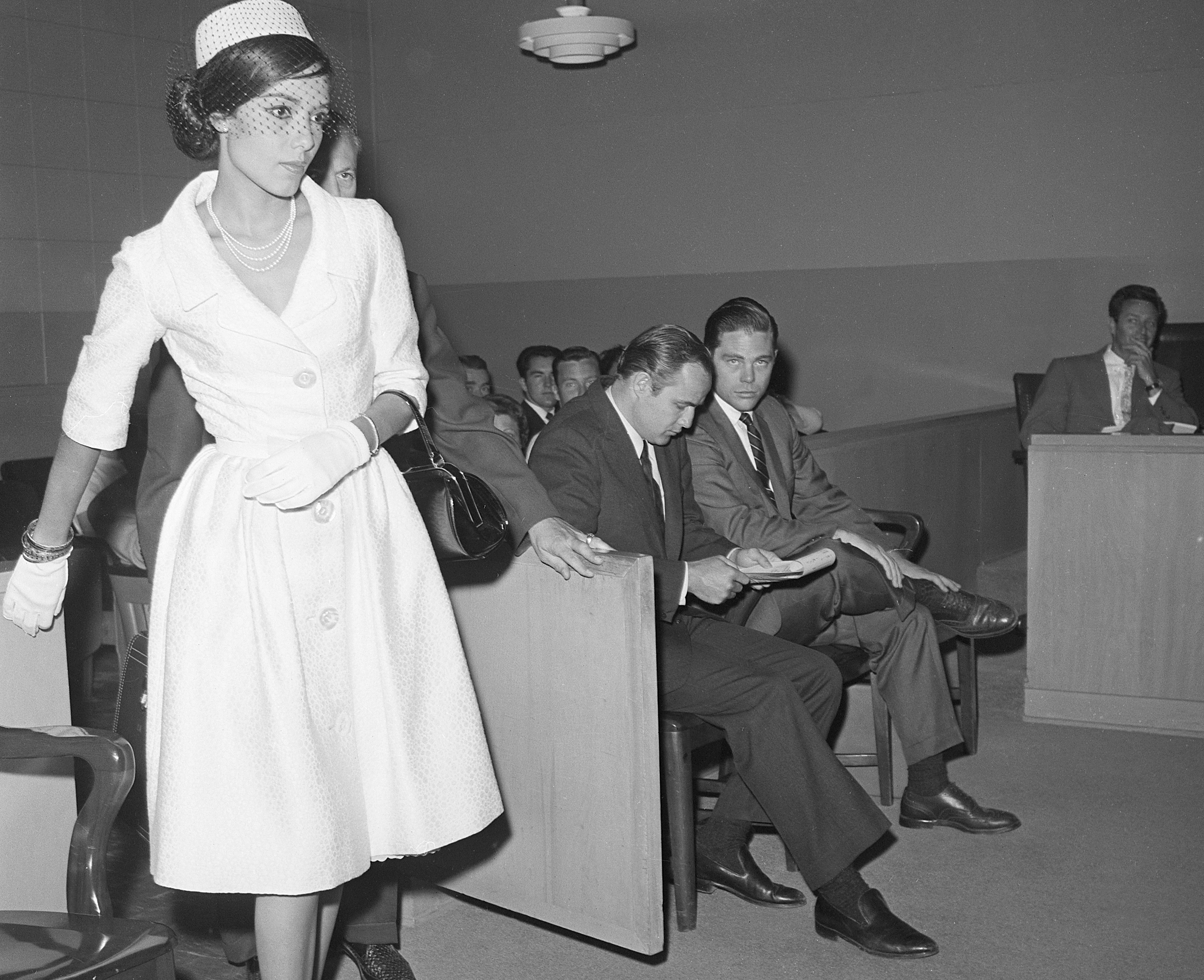 Anna Kashfi  in white dress Enters Court And Brando Ignores