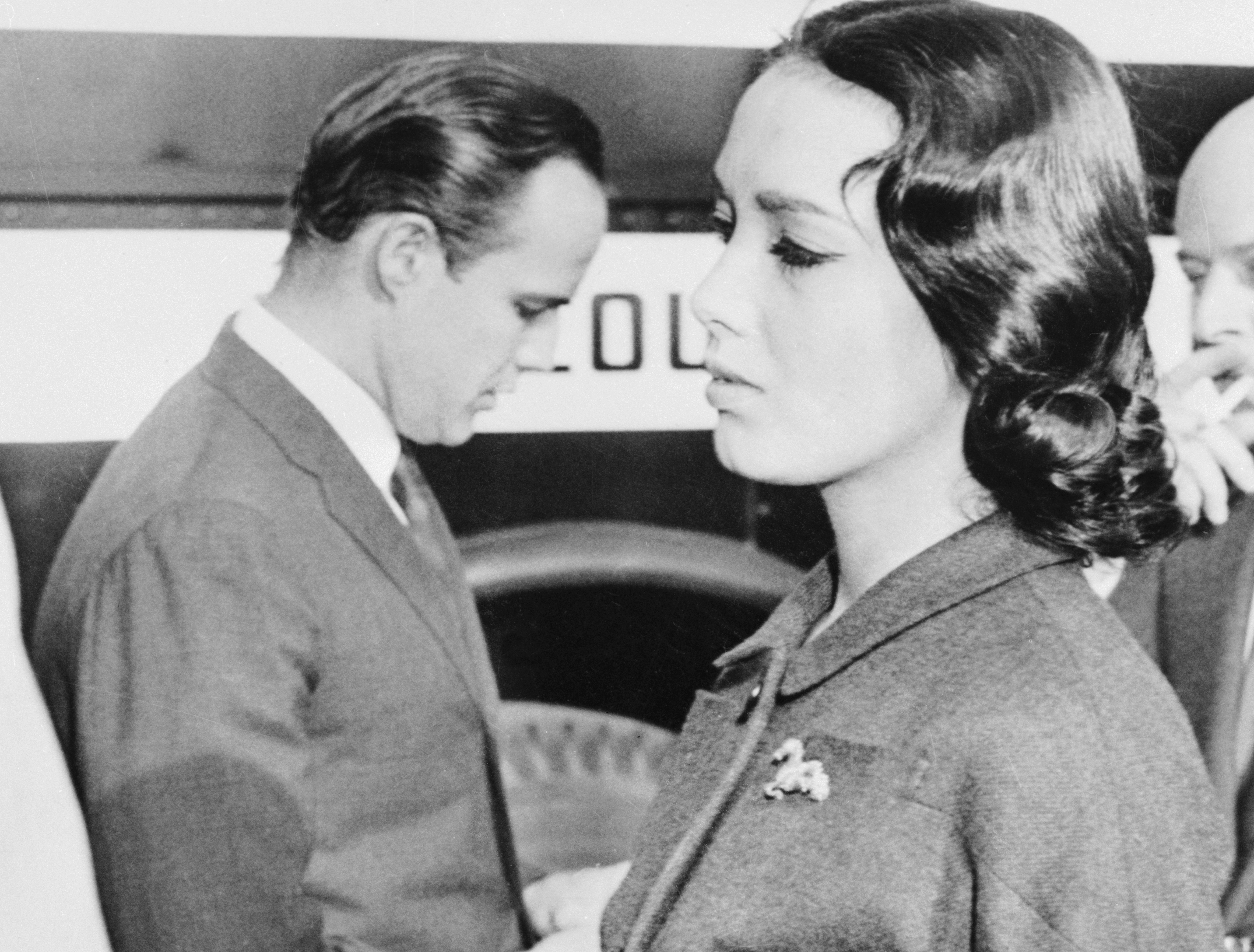 Actress Anna Kashfi (right) and her divorced husband, actor Marlon Brando at court
