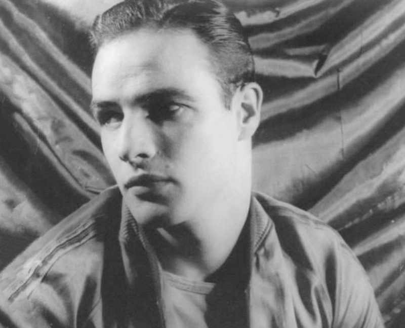 Marlon Brando in jacket facing left