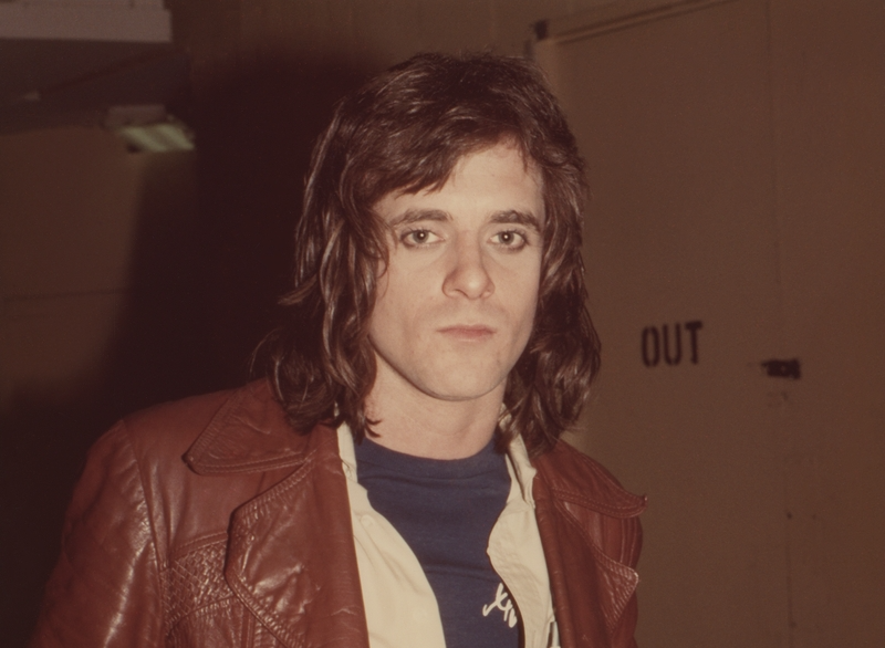 Eddie Money backstage at the Garden in Boston, Massachusetts, wears brown letter leather jacket