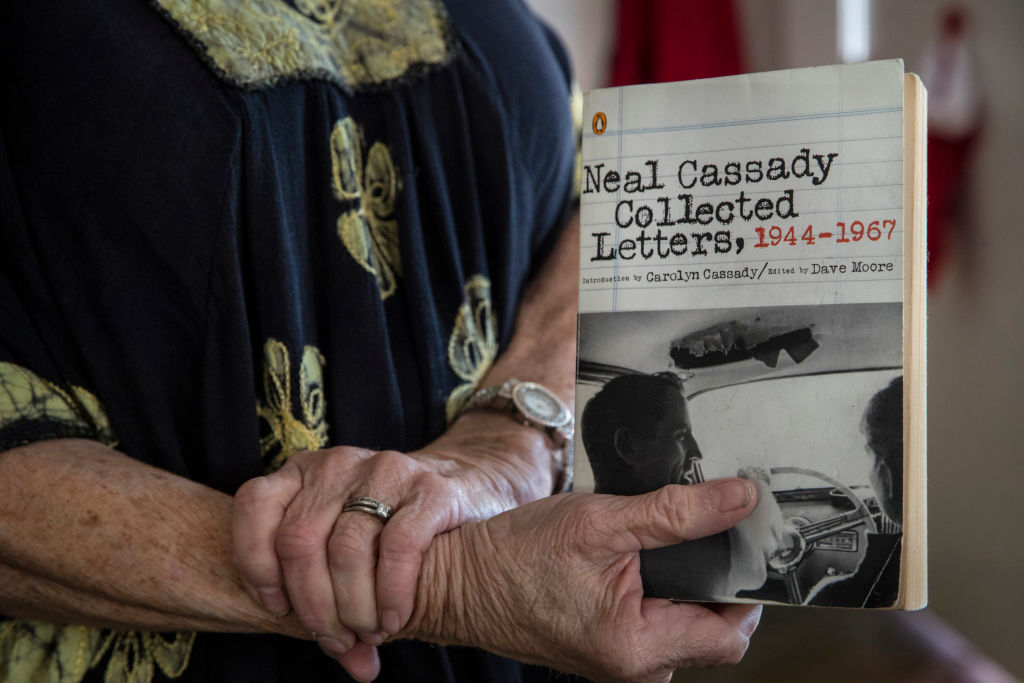Jami Cassady holds a book by her father Neal Cassady