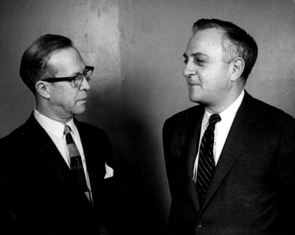 Justin W. Brierly, left, Discusses Immigrant Activities