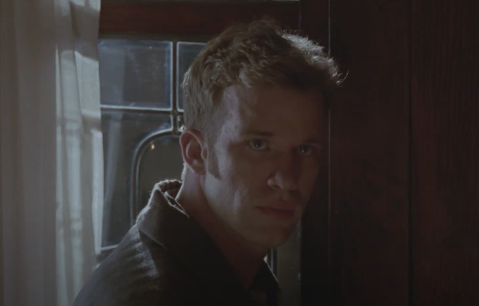 Thomas Jane as  Neal Cassady in blue shirt