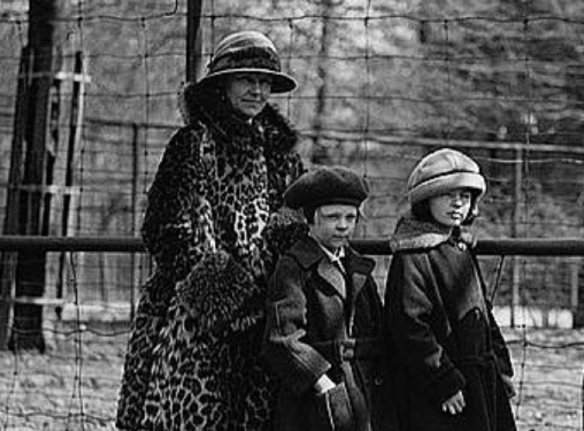 A group of people standing outside.