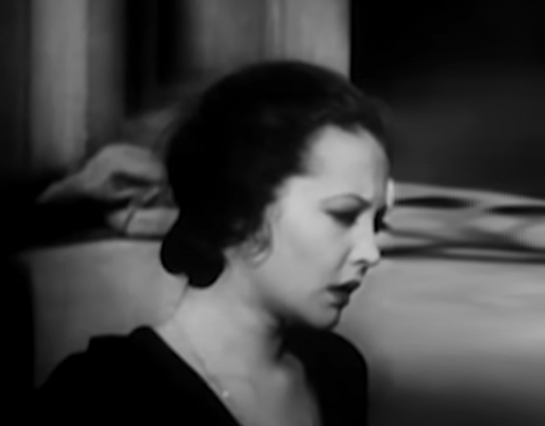 Screenshot of Sylvia Sidney looking down sad.