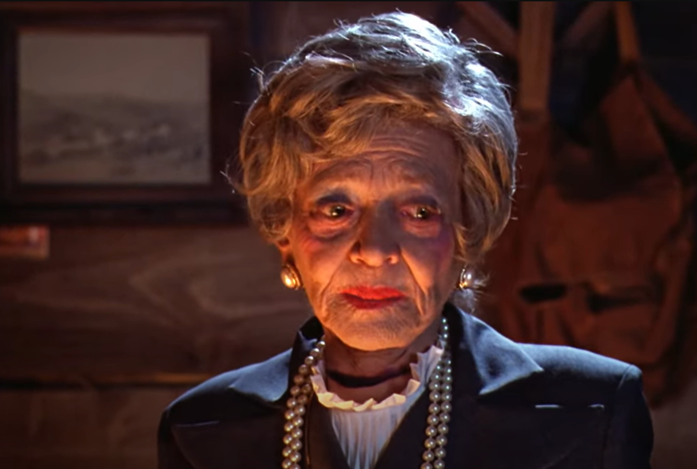 Screenshot of Sylvia Sidney looking at side - from Beetlejuice (1988) 