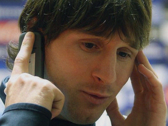 Lionel Messi talking on the phone
