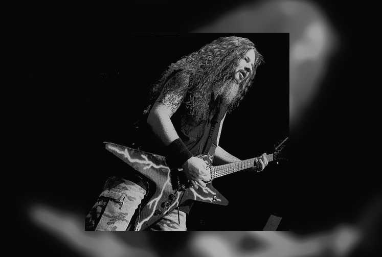 Dimebag Darrell playing a guitar