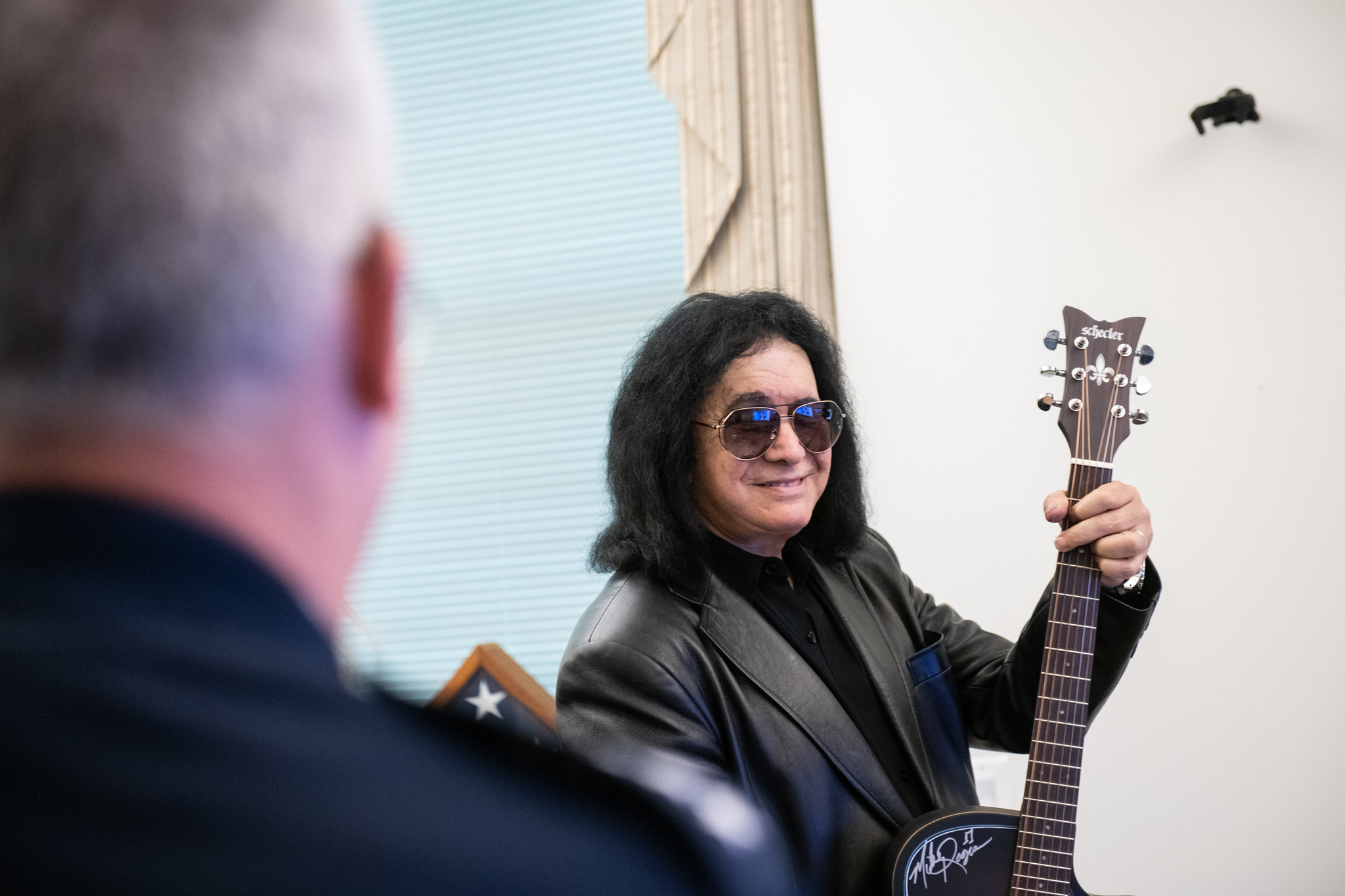 Gene Simmons in black with a guitar