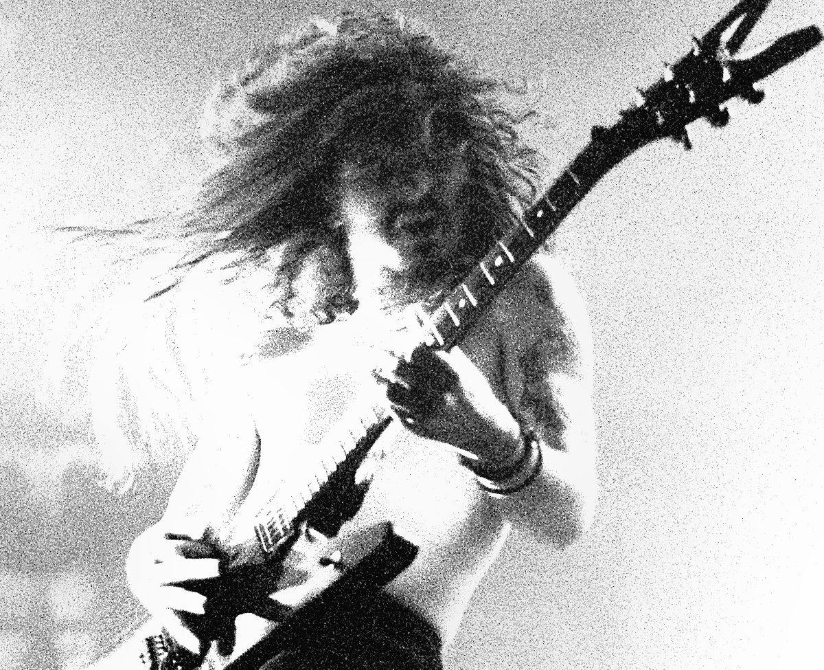 Dimebag Darrell With Pantera playing a guitar