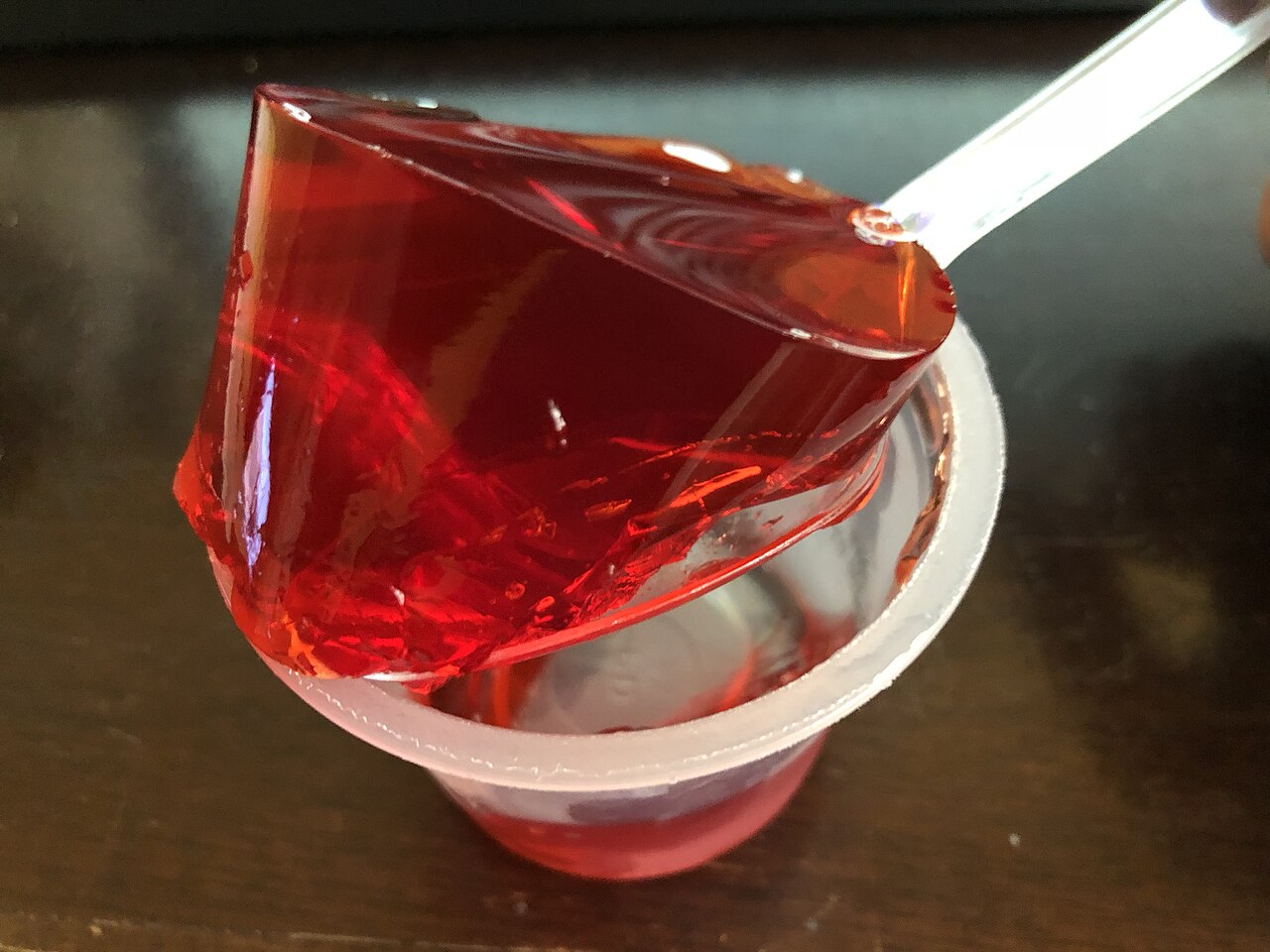 Opened Cup Of Jell-O Strawberry Gelatin Snack